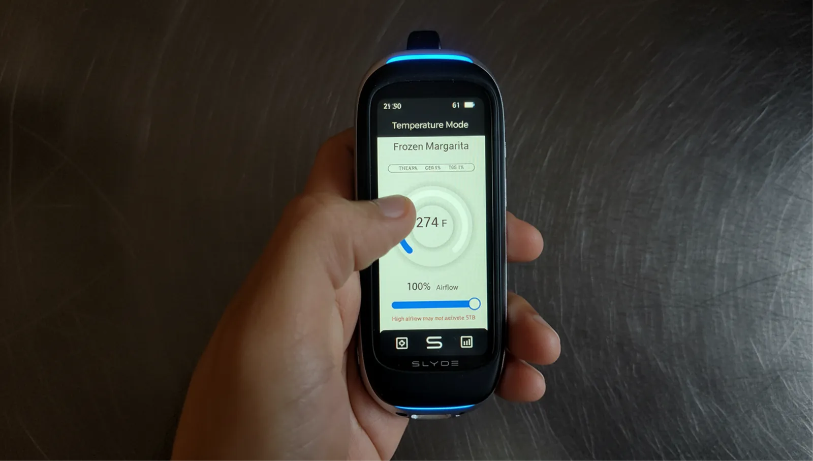 Hand holding Slyder Pro in Temperature Mode